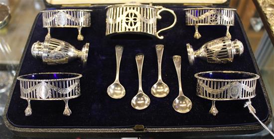 Goldsmiths & Silversmiths 7-pce Adam-style silver condiment set, in fitted case with 4 spoons, London 1916